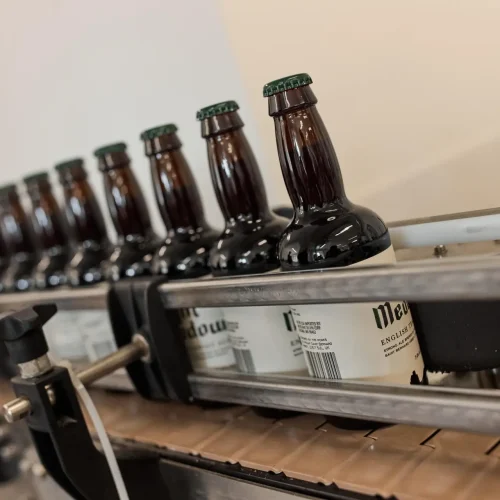 Tynt Medow Trappist ale bottles on production line at the brewery