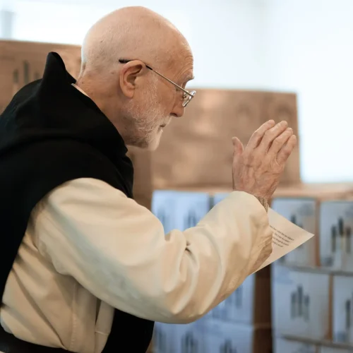 Mount St Bernard Abbey monk blessing cases of Tynt Meadow before they are dispatched