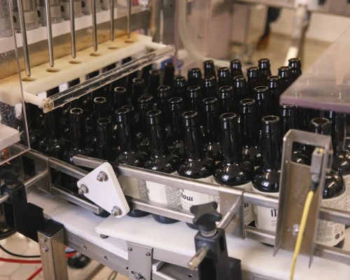 Bottles of Tynt Meadow on the production line at Mount St Bernard Abbey Brewery