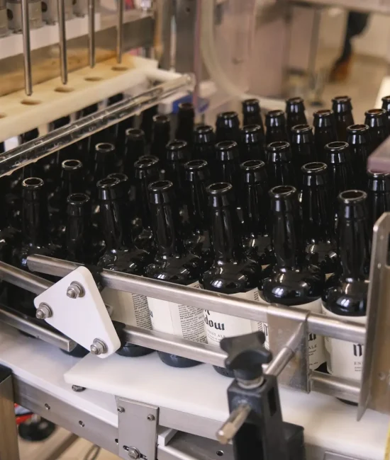 Bottles of Tynt Meadow on the production line at Mount St Bernard Abbey Brewery